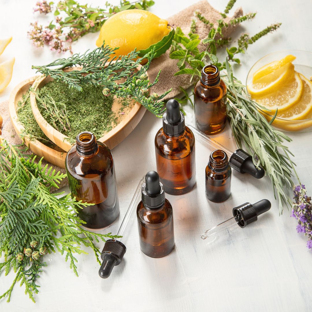Herbal remedies with bottles and droppers on a white background