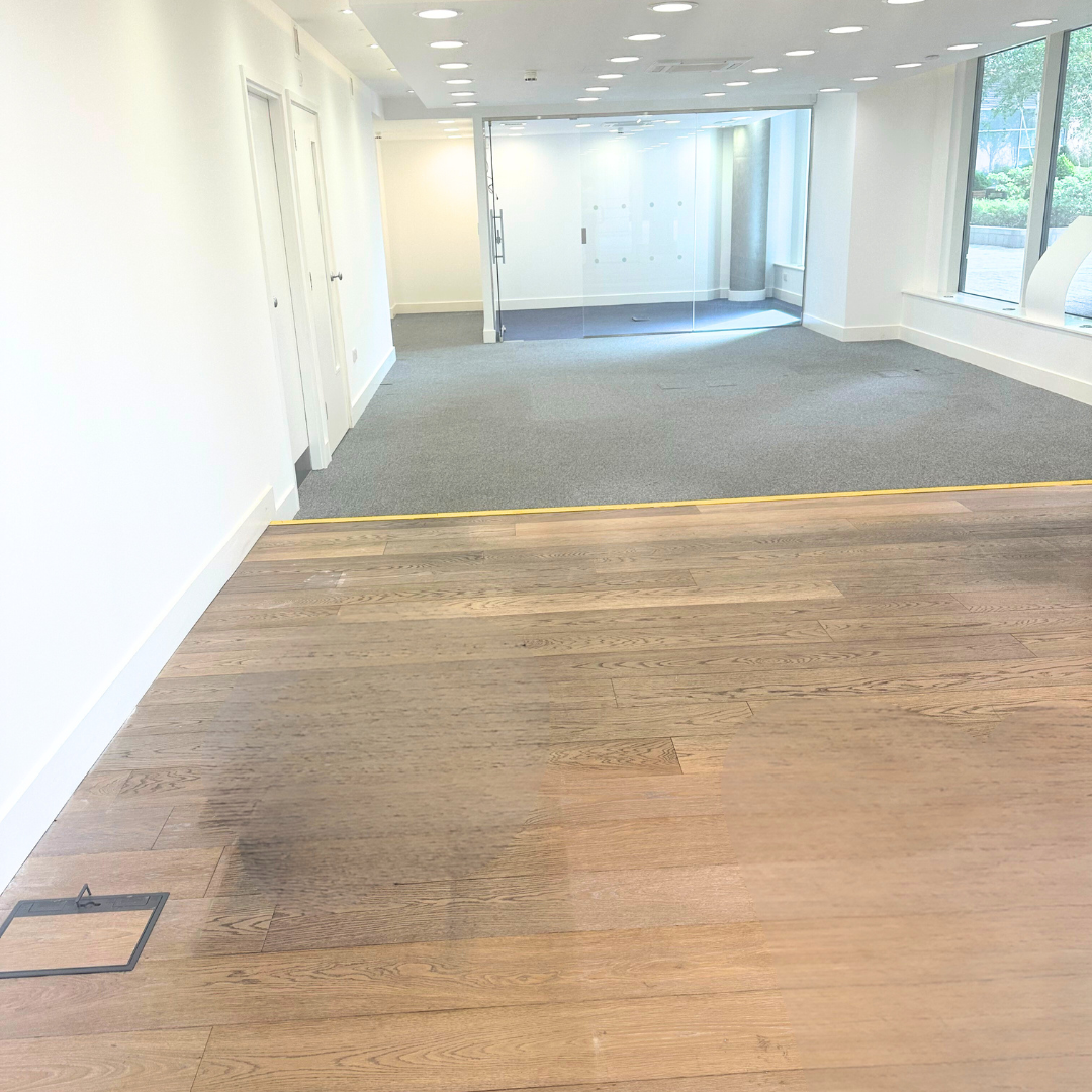 Room with wooden floor and natural light